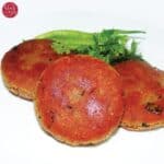 3 Golden brown shami kabab with white background.