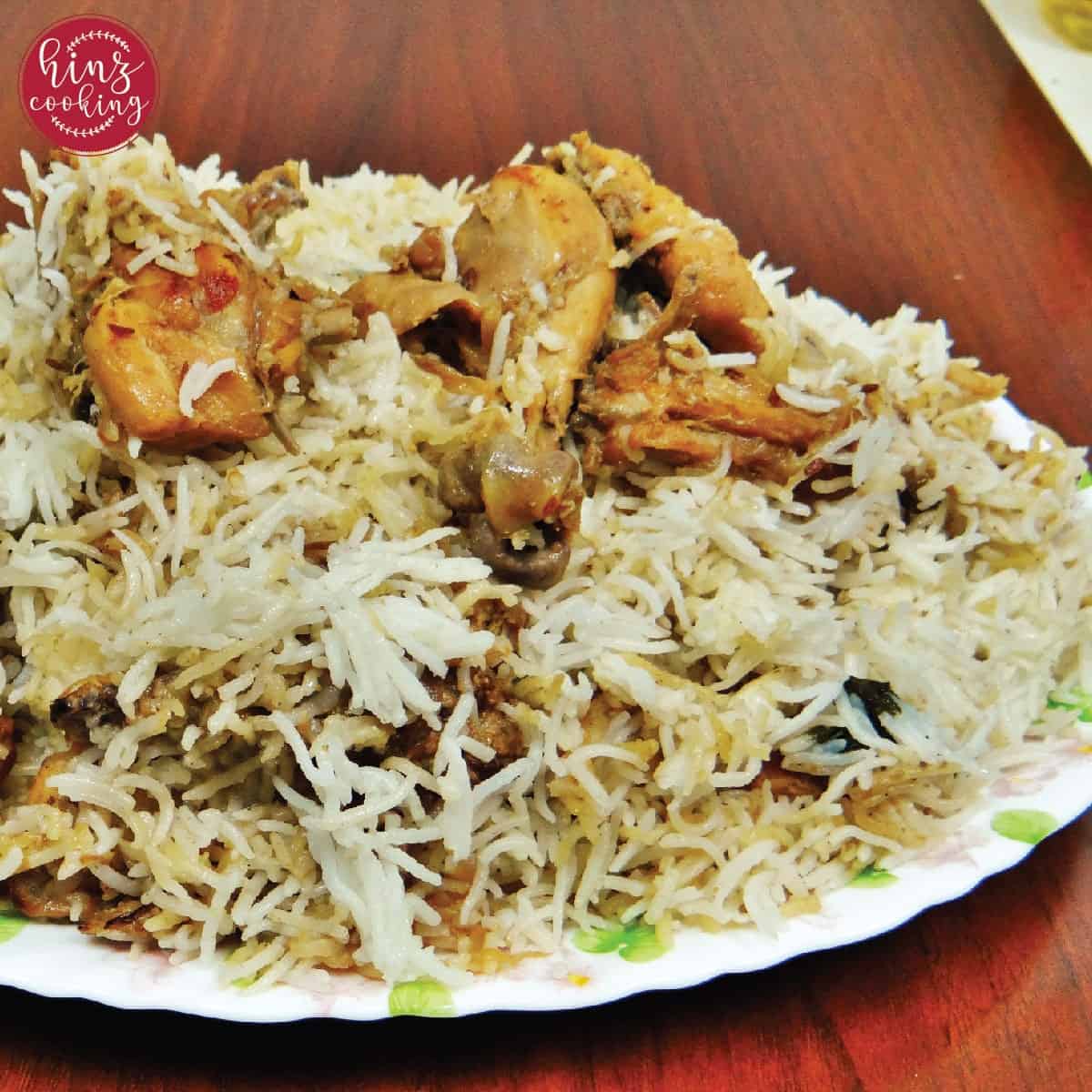 white chicken biryani in big platter - brown background