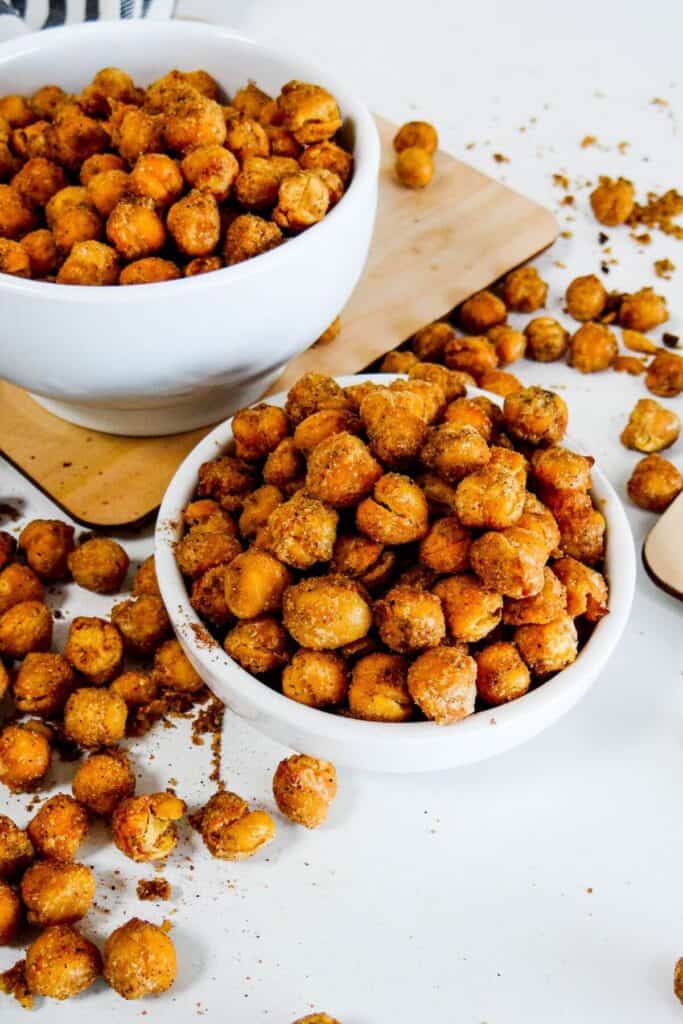 White bowl filled with air-fried roasted chickpeas, shown up close to highlight their crispy texture.